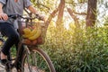 Young woman ride with bicycle to home from shopping Royalty Free Stock Photo