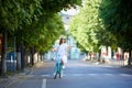 Young woman rides at road on retro bike, summer day Royalty Free Stock Photo