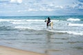 Young woman riding along the beach in his white horse Royalty Free Stock Photo