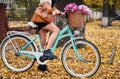 Young woman riding bicycle in centre city. Royalty Free Stock Photo