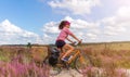 Young woman riding bicycle in the countryside Royalty Free Stock Photo