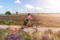 Young woman riding bicycle in the countryside Royalty Free Stock Photo