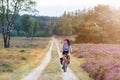 Young woman riding bicycle in the countryside Royalty Free Stock Photo