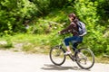 Young Woman Riding a Bicycle in the Countryside