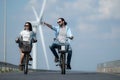 Young woman riding a bicycle with her boyfriend Royalty Free Stock Photo