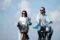 Young woman riding a bicycle with her boyfriend Royalty Free Stock Photo