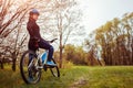 Young woman riding a bicycle in spring forest. Helathy lifestyle concept Royalty Free Stock Photo