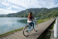 Young woman riding bicycle