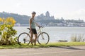 Young Woman Riding Bike outside with quebec view Royalty Free Stock Photo