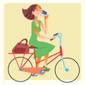 Young woman riding a bike and talking on the smartphone