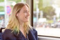 Young woman riding in a bus listening to music Royalty Free Stock Photo