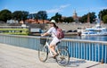 Young woman riding city bicycle near sea Royalty Free Stock Photo