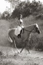 Young woman riding on horse (motion blur) Royalty Free Stock Photo