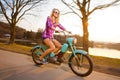 Young woman riding a lifestyle vintage bike