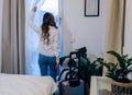 Young woman on the road arrives in her hotel room Royalty Free Stock Photo