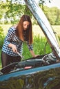 Young woman by the roadside after her car has broken down. Toned Image Royalty Free Stock Photo