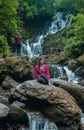 Young woman after a rock climb watching and exploring Torc Waterfall in the Killarney National Park, Ring of Kerry Tour, Ireland Royalty Free Stock Photo