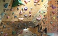 Young Woman Rock climber is Climbing At Inside climbing Gym. slim pretty Woman Exercising At Indoor Climbing Gym Wall Royalty Free Stock Photo