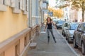 Young woman roller skating down an urban street Royalty Free Stock Photo