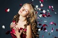 Young woman with rose flower petals Royalty Free Stock Photo