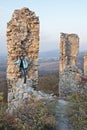 Young woman and ruins of the castle