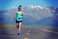 Young woman runner running on trail Royalty Free Stock Photo