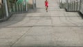 Woman running up city stairs