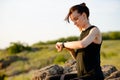 Young Woman Runner Using Multisport Smartwatch at Sunset Trail. Closeup of Hand with Fitness Tracker. Sports Concept Royalty Free Stock Photo