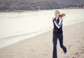 Young Woman running along the beach