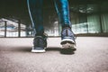 Young woman running away in an industrial scene, during sunrese. Royalty Free Stock Photo