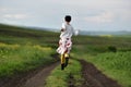 Young woman running on a countryside road Royalty Free Stock Photo