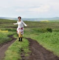 Young woman running on a countryside road. Freedom concept Royalty Free Stock Photo