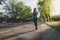 Young woman running, jogging in the park. Exercising outdoor