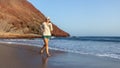 Young woman running on La Tejita beach, Tenerife , Spain Royalty Free Stock Photo