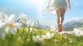 Young woman running on a meadow with flowers in the spring. Royalty Free Stock Photo