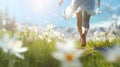 Young woman running on a meadow with flowers in the spring. Royalty Free Stock Photo