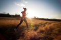 Young woman running outdoors Royalty Free Stock Photo