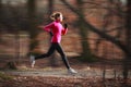 Young woman running outdoors Royalty Free Stock Photo