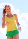 Young woman running outdoors Royalty Free Stock Photo