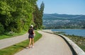 Young woman running in the park at morning. Woman runner outside jogging. Asian fitness sport woman running on city road Royalty Free Stock Photo