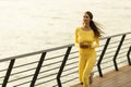 Young woman running on the riverside pier Royalty Free Stock Photo