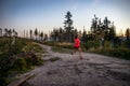 Young woman running on rocks. Royalty Free Stock Photo