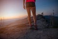 Young woman running on rocks. Royalty Free Stock Photo