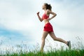 Young woman running summer park rural road Royalty Free Stock Photo