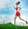 Young woman running summer park rural road. Outdoor exercises. J Royalty Free Stock Photo