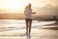 Young woman running on the La Tejita beach Royalty Free Stock Photo