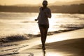 Young woman running on the La Tejita beach Royalty Free Stock Photo