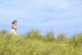 Young Woman Running through Tall Grass in meadow Royalty Free Stock Photo