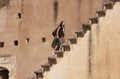 Young woman running up the stairs, Bundi Palace, India Royalty Free Stock Photo