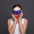 Young woman with Russian flag painted on her face Royalty Free Stock Photo